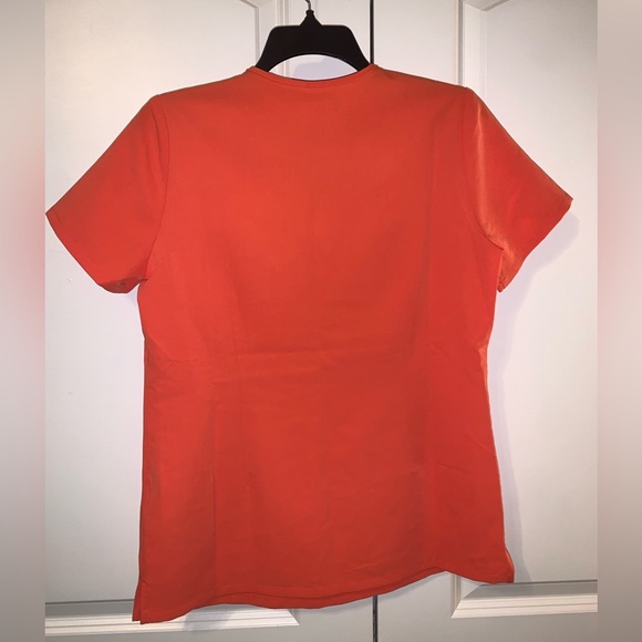 FIGS Orange one pocket Scrub Top. NWT - Picture 3 of 3